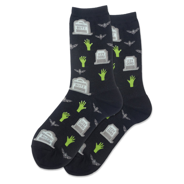 Pair of dark crew socks featuring a pattern of gray gravestones, lime green zombie hands, and small bats. }}