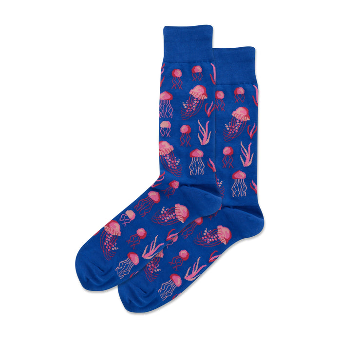 Pair of blue crew socks featuring a pixelated pink jellyfish and seaweed pattern. }}