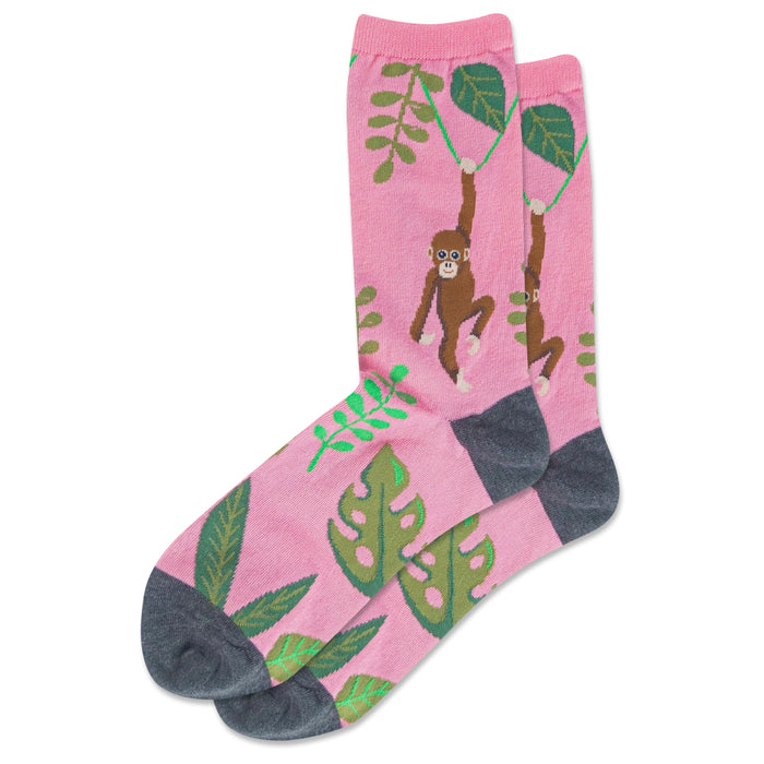 Crew socks, pink base with brown monkeys swinging from vines and green tropical leaves, dark grey heel and toe. }}