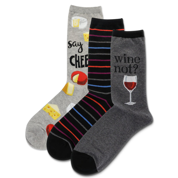 Three crew socks: one grey with cheese illustrations and 'Say Cheese', one black with colorful stripes, and one grey with a wine glass and 'Wine not?' }}