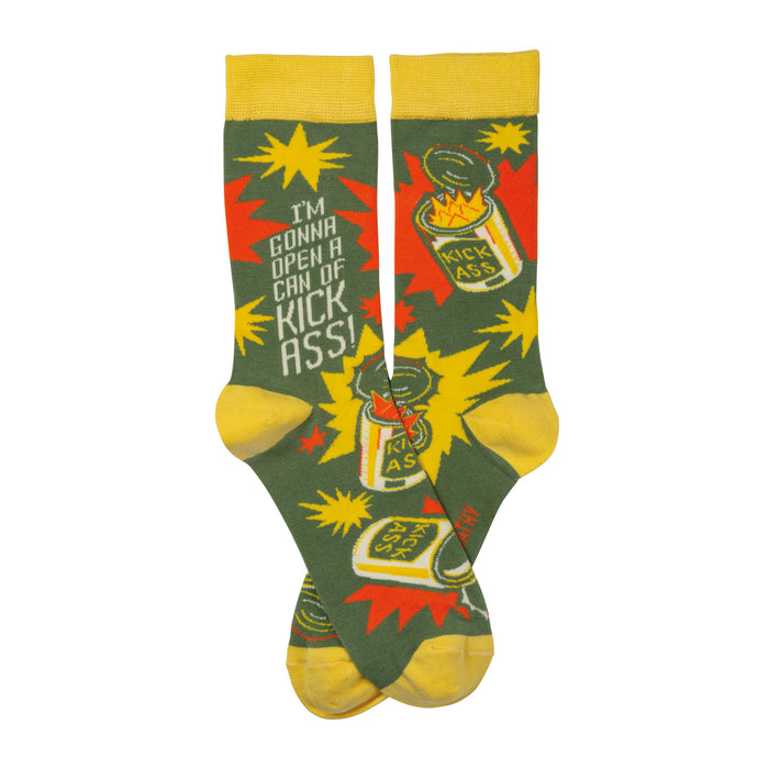 Crew socks, olive green with yellow cuffs. Design features exploding cans labeled 'Kick Ass!' and the phrase 'I'm gonna open a can of Kick Ass!' }}