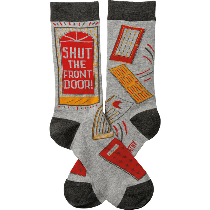Crew socks in grey with dark grey cuffs and toes. Design features a red 'Shut The Front Door!' message and various door and mail illustrations. }}