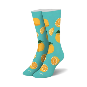 Pair of crew socks. Light teal background with a pattern of yellow lemons and lemon slices.