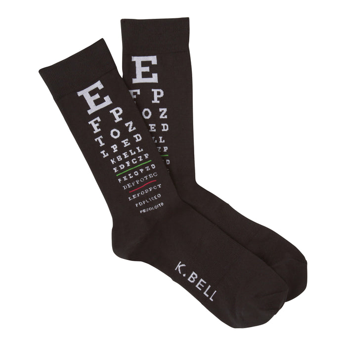 A pair of dark brown crew socks with a white eye chart pattern printed on them. The text includes letters and symbols typical of eye exams. 'K.BELL' is visible on the bottom. }}