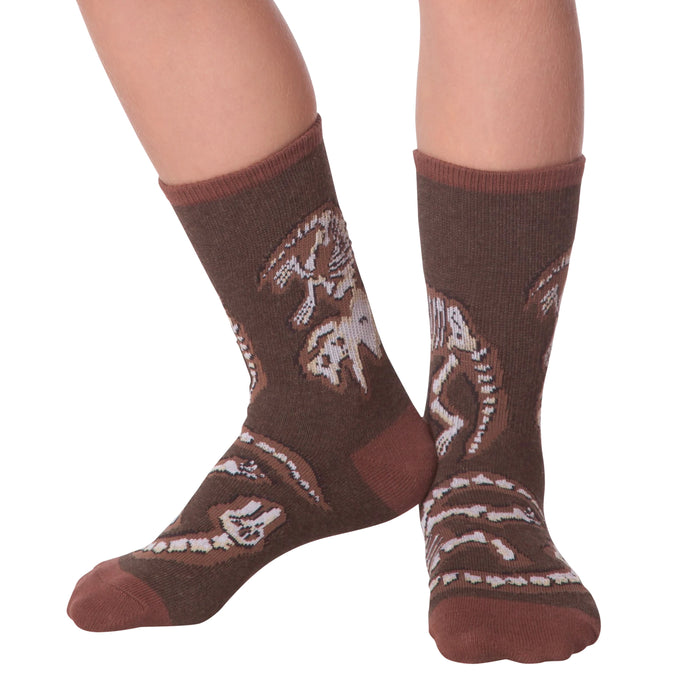 Lifestyle shot of Dino Bones socks on a person's feet.