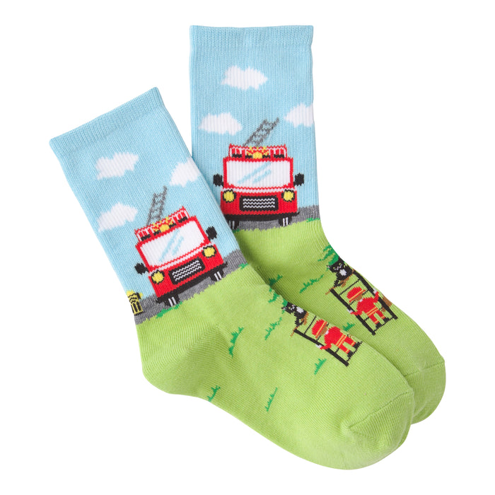 Pair of crew socks; light blue with clouds and red firetruck, lime green with firefighter and tree. Playful design.