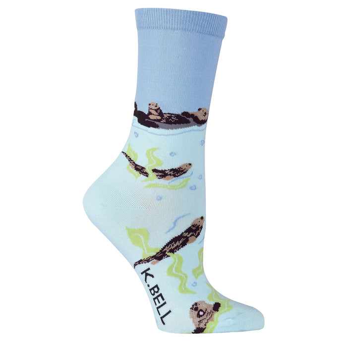 Crew socks in light blue, featuring otters swimming amongst kelp and bubbles. A playful and charming design. }}
