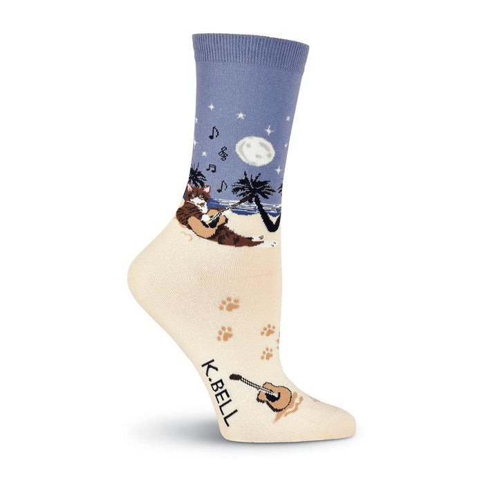 Crew socks showing a cat playing guitar on a beach at night.  The main colors are cream, blue, and brown. }}