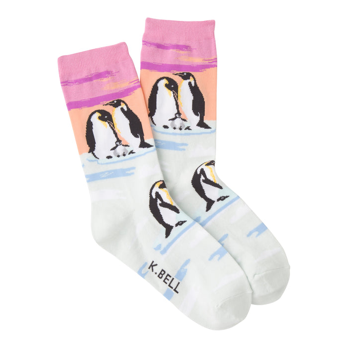 Crew socks in pastel pink, peach, and mint green featuring an illustration of Emperor penguins on ice floes. }}