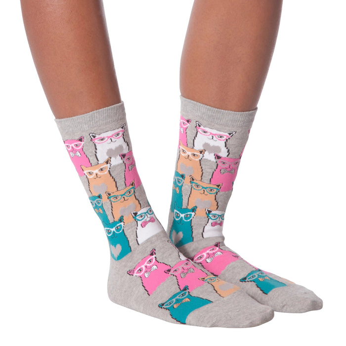 Lifestyle shot showing a model wearing white Smarty Cats socks.