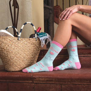 Lifestyle shot featuring 'Rose All Day' socks and a picnic basket.