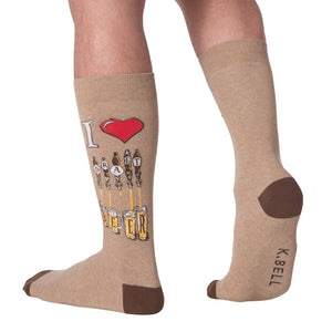 Lifestyle shot of a person wearing the tan 'Draft Beer' socks. The design is partially visible.