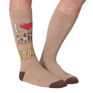Flat lay of a pair of tan 'Draft Beer' socks showing the full design, including the 'I heart Draft Beer' graphic and beer tap image.