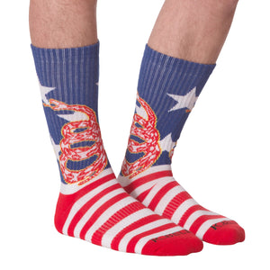 Front view of 'Don't Tread' socks on a person's legs.
