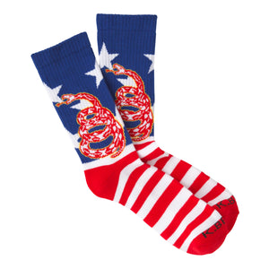 Crew socks in red, white, and blue. The design features a coiled snake on a background of stars and stripes.