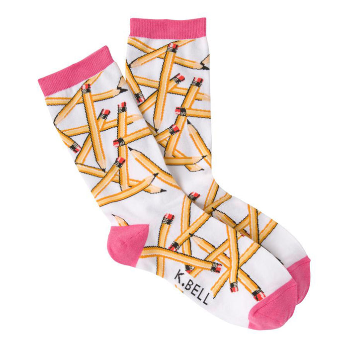 A pair of white crew socks with a playful pattern of yellow pencils scattered across them. The socks have hot pink cuffs. }}