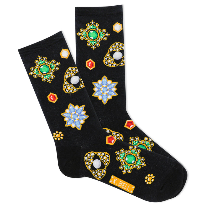 A pair of black crew socks featuring a pattern of colorful jeweled brooches and flower shapes with gold accents. }}