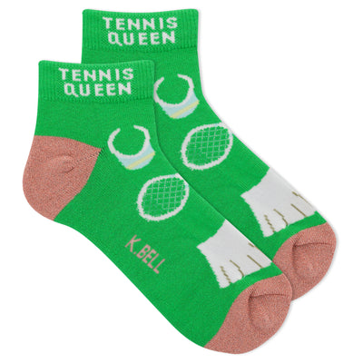 Pair of lime green ankle socks.  Features a tennis-themed pattern with white tennis rackets and balls. Pinkish-peach heel and toe.