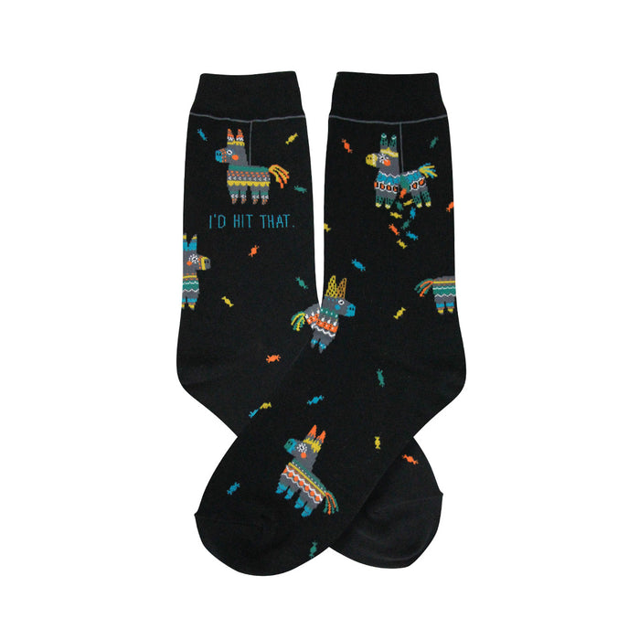 A pair of black crew socks with a fun pattern. The design includes colorful piñatas and the phrase
