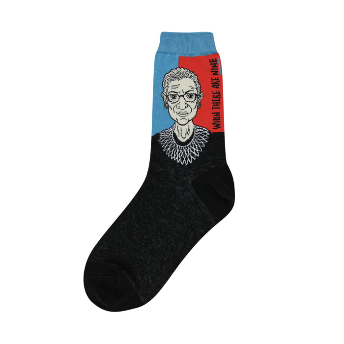 Crew socks showing a portrait of Ruth Bader Ginsburg in light blue and orange-red, with black foot and the phrase 'When there are nine'. }}