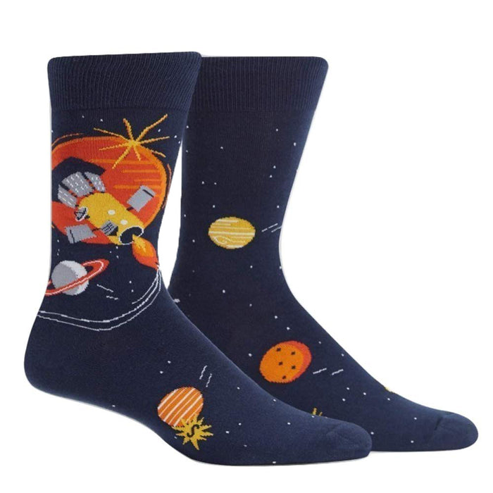 A pair of navy blue crew socks with a space-themed design. The design includes a rocket ship, planets in orange and yellow, and stars on a dark blue background. }}