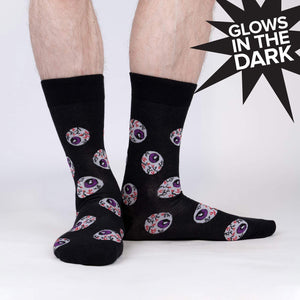 Lifestyle shot showing the glow-in-the-dark eye socks on a person's legs.