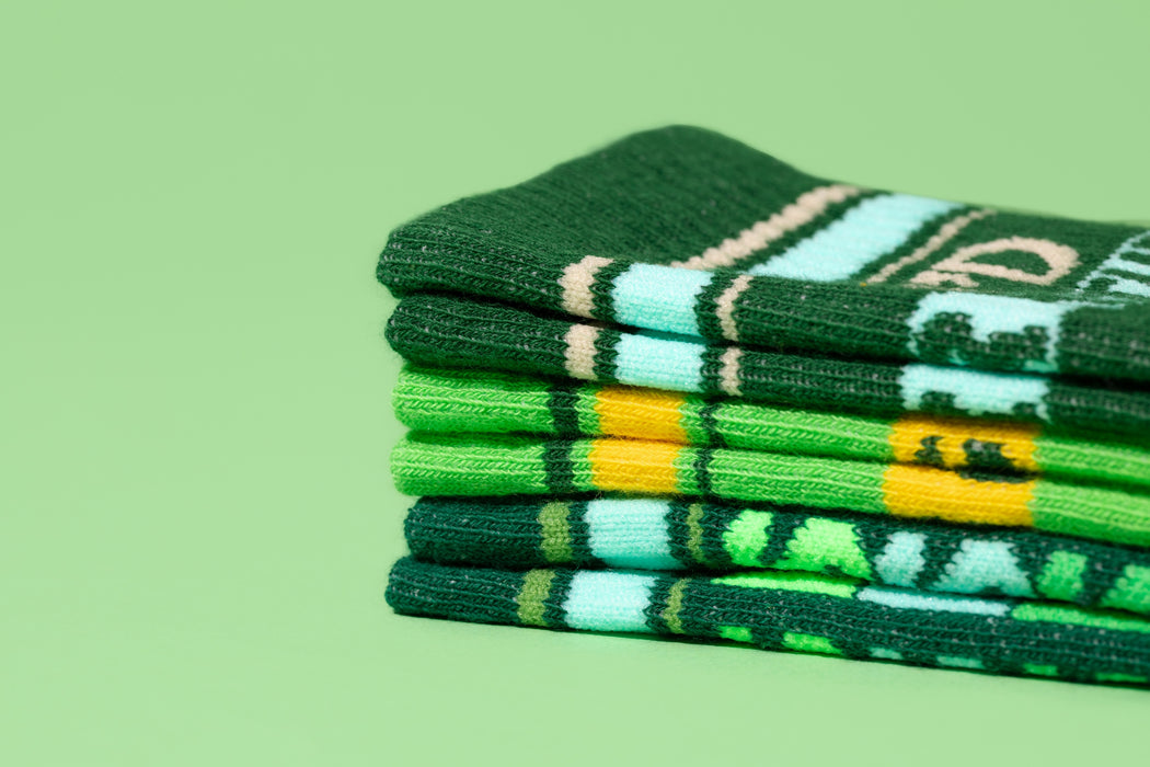 Close-up detail shot focusing on the sock's fabric and text.