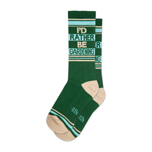 Crew socks in dark green, teal, and beige. The design features the words 'I'd Rather Be Gardening' in a horizontal stripe pattern.