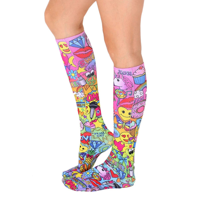 Back view of the knee-high socks, showing the full design. The pink base is covered in colorful graphics.