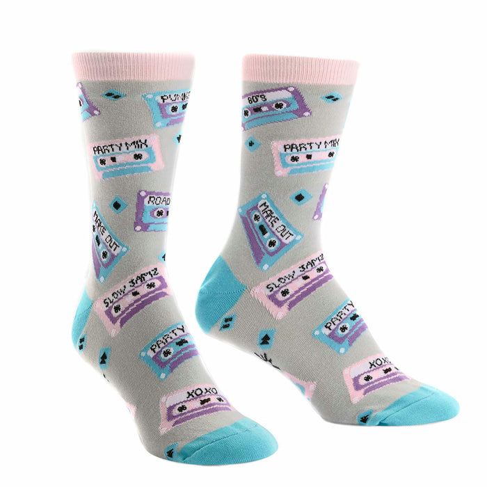 A pair of crew socks with a light grey background, featuring colorful retro cassette tapes and 80's themed text. }}
