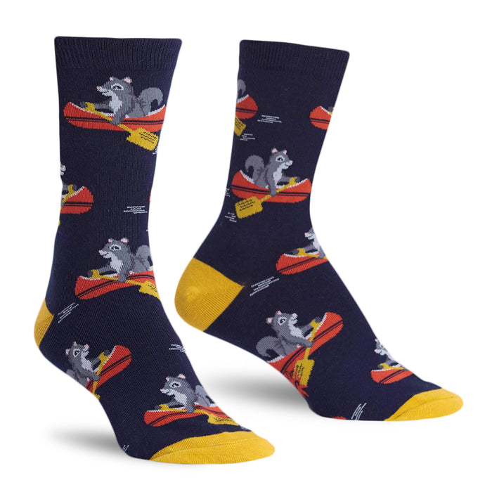 Crew socks in navy blue and mustard yellow, featuring a repeating pattern of squirrels paddling red canoes. }}