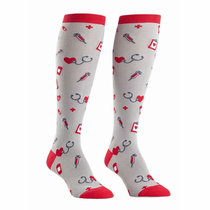Pair of grey knee-high socks with a pattern of red hearts, stethoscopes, syringes, and medical crosses. Red cuffs. }}