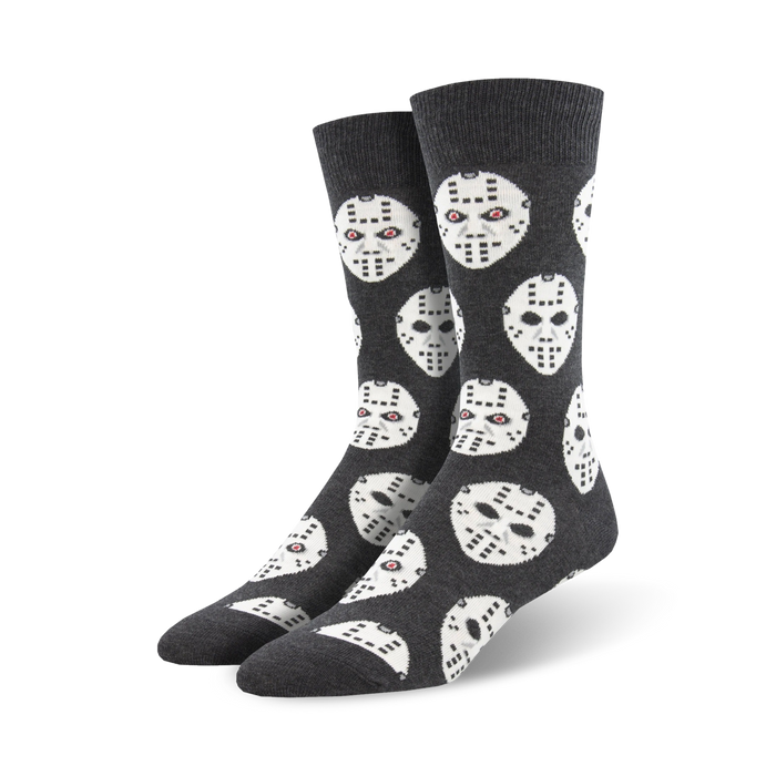 Crew socks in dark grey featuring a repeated pattern of white hockey masks with small red eye details. }}