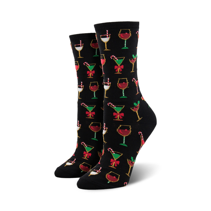 Crew socks in black with a colorful Christmas cocktail pattern. Red, green, gold, and white glasses with candy canes and bows are featured on the black background. }}