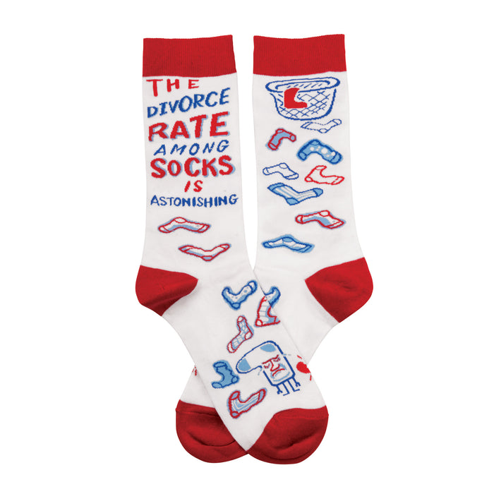 White crew socks with red cuffs. The design includes a humorous text statement about sock divorce and small illustrations of mismatched socks. }}