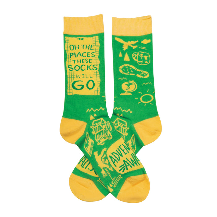 Crew socks in bright green and yellow. The design features a travel theme with a quote, airplane, globe, and camping icons. }}