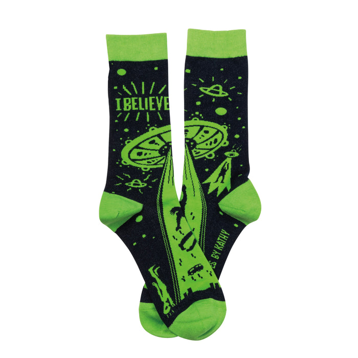 Pair of crew socks. Dark navy blue with lime green UFO, alien, and 'I BELIEVE' design. }}