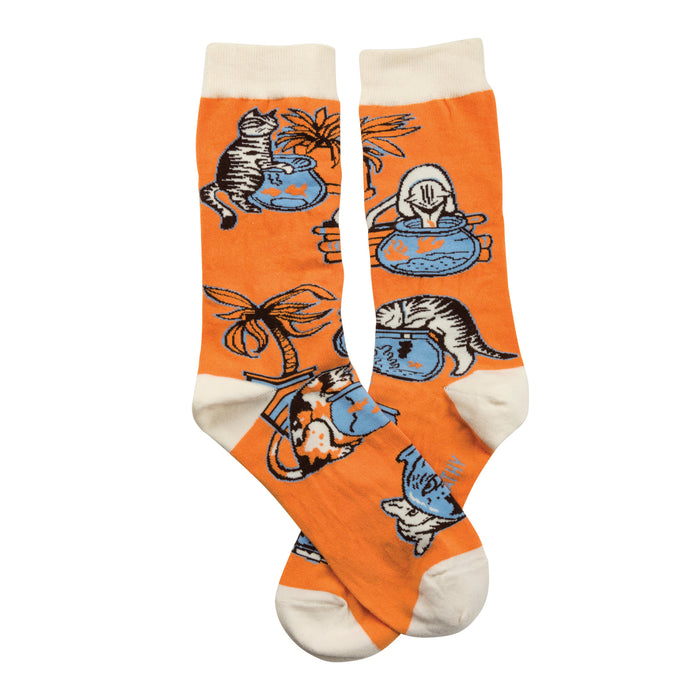 Pair of orange crew socks with a playful illustration of cats looking at fishbowls and a palm tree.  White cuffs. }}