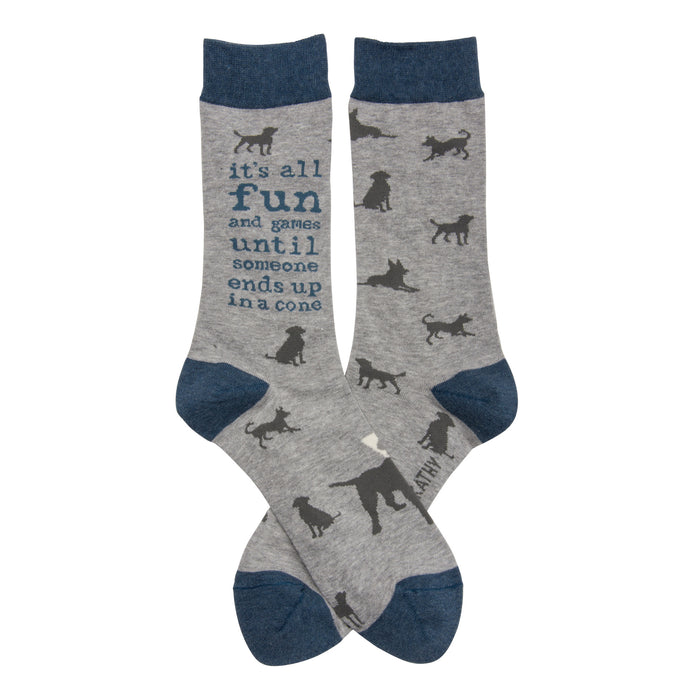 Crew socks in grey with a navy blue cuff. The socks feature a repeating pattern of dark grey dog silhouettes and the text 'It's all fun and games until someone ends up in a cone'. }}