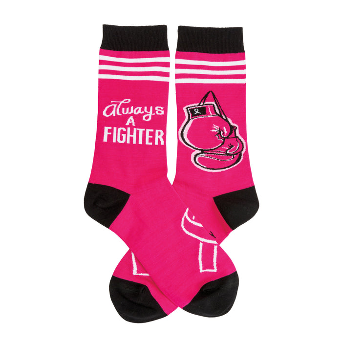 Crew socks in hot pink with black cuffs and toe.  A boxing glove graphic and 'Always A Fighter' text are featured on the sock. }}