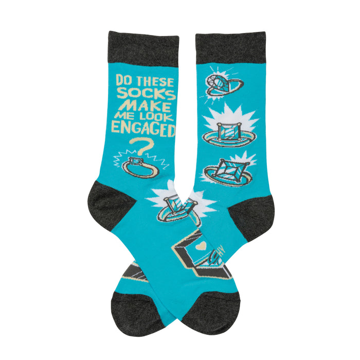 Crew socks in turquoise with gray cuffs. The design features cartoon rings, diamonds, and the text 'Do these socks make me look engaged?' }}