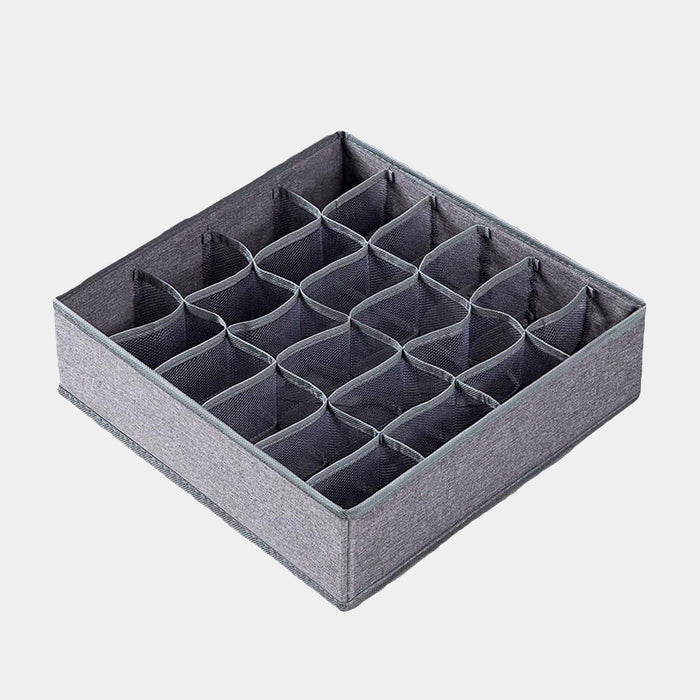 Empty grey fabric sock organizer with 24 compartments, showing the internal structure.