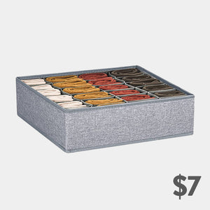 Grey fabric sock organizer with 24 individual compartments.  Perfect for storing and organizing socks of various colors.
