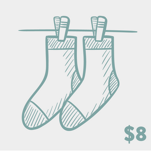 Product shot of two crew socks hanging on a clothesline.  They're a muted teal/purple, with a hand-drawn sketch design.