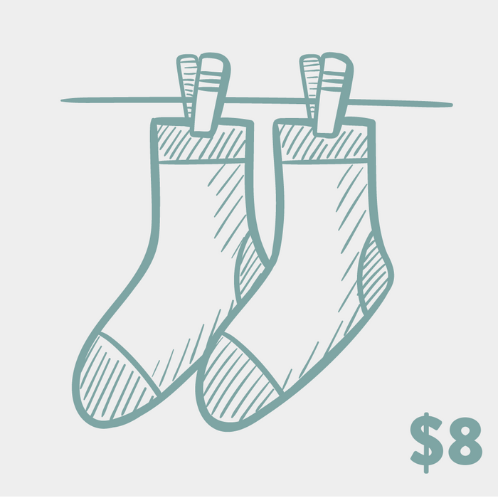 Product shot of two crew socks hanging on a clothesline.  They're a muted teal/purple, with a hand-drawn sketch design.