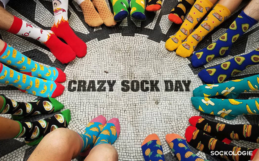 A photo of people in a circle with crazy socks on