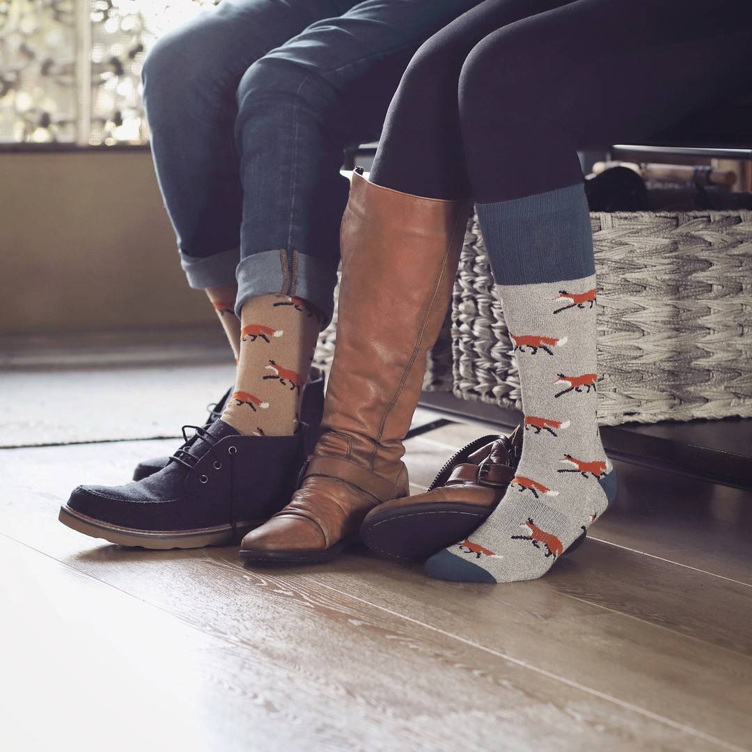 a couple wearing matching boot socks