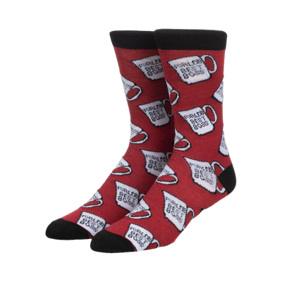 Pair of red crew socks featuring a repeating pattern of white mugs that say 'World's Best Boss'. Black cuff.