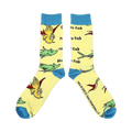 Close-up of a pair of yellow crew socks with illustrations from One Fish Two Fish.