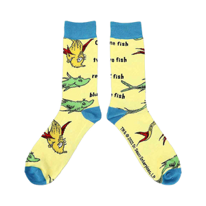 Close-up of a pair of yellow crew socks with illustrations from One Fish Two Fish.